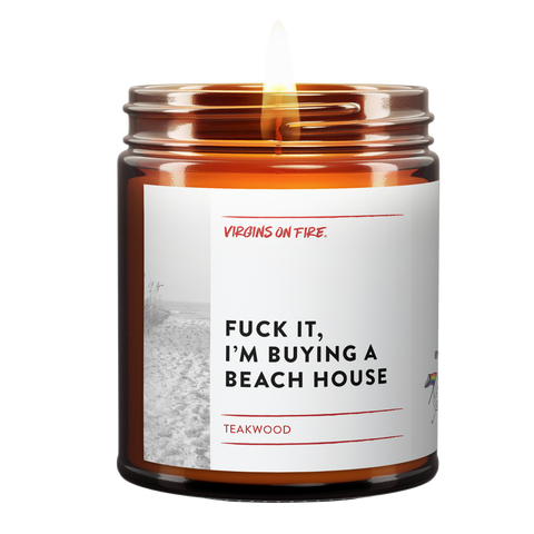 Fuck It, I'm Buying a Beach House is the name of a candle from Virgins On Fire Candle Co. It is Teakwood scented, and available for sale online for $15 at www.virginsonfire.com