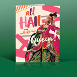 a regal and ornate card that says All Hail The Motherf*cking Queen. Features a Queen looking regal.