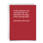 a red greeting card with white font. white envelope. the message is, 'at this point in my romantic life i've learned to be okay with average dick. anyway, love you!"