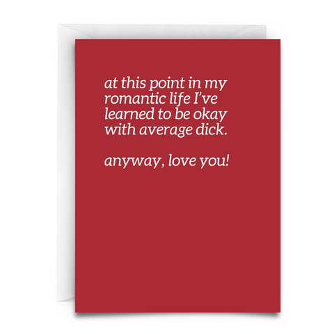 a red greeting card with white font. white envelope. the message is, 'at this point in my romantic life i've learned to be okay with average dick. anyway, love you!"