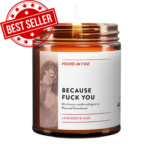 Amber glass candle from Virgins On Fire Candle Co., a gay-owned Brooklyn funny candle business. Features an activism-focused label noting a $5 Planned Parenthood donation for every unit sold. Lavender and sage scent. Handcrafted soy wax candle with lit wick.
