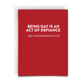 BEING GAY IS AN ACT OF DEFIANCE GREETING CARD from Virgins On Fire Candle Co. Red card. White font.