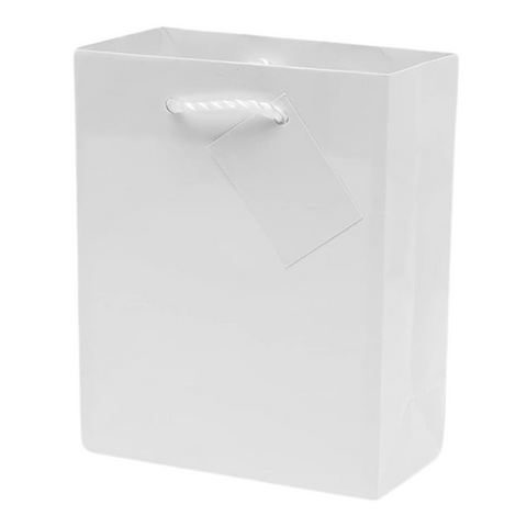 a medium white gift bag for candles. small rope handle. includes tag.