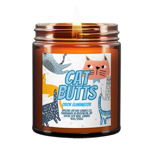 Cat Butts odor eliminator candle from LGBTQ+ owned Virgins On Fire Candle Co. Funny Whimsical label featuring cartoon cats in blue, orange, and gray. 9oz soy wax candle handcrafted in Brooklyn. Humorous gift for cat lovers.