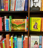 Buying a Cabin the Book on the shelf at barnes and noble. My book is Surrounded by other books on the shelf.