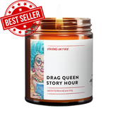 Fig scented candle with illustrated drag queen character in retro style. Handcrafted by queer-owned Brooklyn business Virgins on Fire, featuring 'Drag Queen Story Hour' theme and pride flag detail. Includes BEST SELLER logo in red in upper left corner.