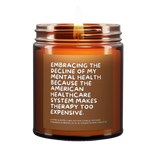 a lit candle called, "Embracing the decline of my mental health because the american healthcare system makes therapy too expensive."
