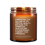 a lit candle called, "Embracing the decline of my mental health because the american healthcare system makes therapy too expensive."