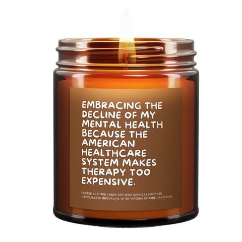 a lit candle called, "Embracing the decline of my mental health because the american healthcare system makes therapy too expensive."