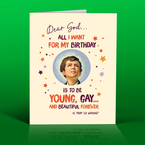 Birthday card with a young boy's portrait and humorous birthday wish text on a green background. It says, Dear God All I want for my birthday is to be young, gay and beautiful forever, is that so wrong?