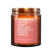 Grapefruit scented candle with a humorous label on a white background