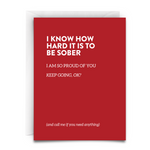 Red greeting card with white envelope. Includes the phrase, "I KNOW HOW HARD IT IS TO BE SOBER. I am so proud of you. Keep going, okay? And call me if you need anything." it is a heartfelt message of sobriety support from virgins on fire candle co.