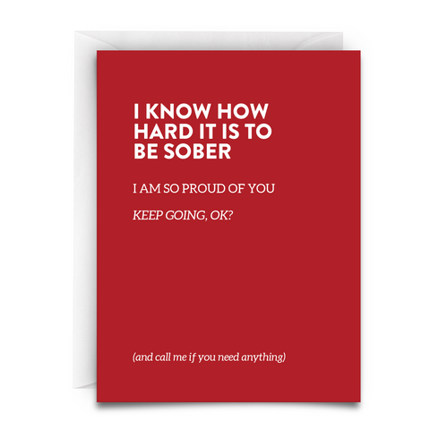 Red greeting card with white envelope. Includes the phrase, "I KNOW HOW HARD IT IS TO BE SOBER. I am so proud of you. Keep going, okay? And call me if you need anything." it is a heartfelt message of sobriety support from virgins on fire candle co.