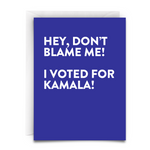 blue background. big bold white font. "Hey, don't blame me, i voted for Kamala!" VOTED FOR KAMALA GREETING CARD - Virgins On Fire Candle Co.