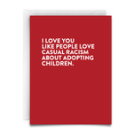 A red card, with white text, and a white envelope. The card reads, " I LOVE you like people love casual racism about adopting children"