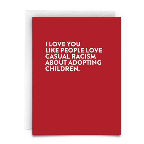 A red card, with white text, and a white envelope. The card reads, " I LOVE you like people love casual racism about adopting children"