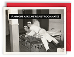 a greeting card with the phrase, "if anyone asks we're just roommates ." features a vintage photograph of two military men laying with one another. one is playfully on top of the other. this is an lgbtq+ greeting card.