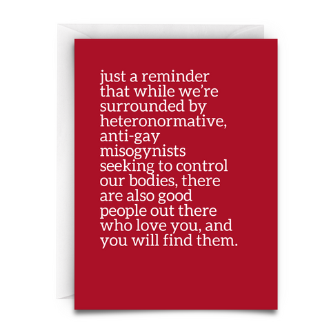 Red greeting card with white text offering support and hope to those facing discrimination. Message acknowledges adversity while affirming that accepting, loving people exist and can be found