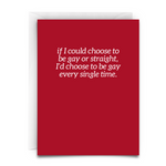 a red greeting card with a white envelope. the card says in white font, "If I could choose to be gay or straight, I'd choose to be gay every single time."