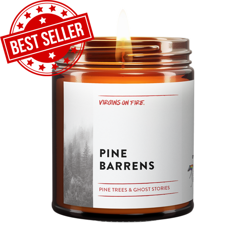 a candle called pine barrens. it is burning.