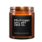 A Lit Amber Jar Candle called, "politicians will not save us"