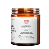 the back of the candle. burning amber jar. says virgins on fire canle co. 100% soy wax, handmade in brooklyn, 40-45 hours burn time, non-toxic, phthalate-free, 9oz255g and the social media handes, along with the sketch of a flame cartoon with an lgbtq+ flag, and that this candle was handmade by a gay man.