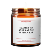 a burning brown jar candle called scatter my ashes at the lesbian bar - it's leather and rose - and from Virgins On Fire.