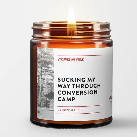 Handcrafted soy candle by Virgins On Fire Candle Co., gay-owned Brooklyn candle company. This funny candle shows vintage black and white camp scene imagery. Features cypress and lust scent blend. 