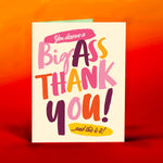 A colorful card with the text: "You deserve a big ass thank you...and this is it." pastel easter pinks, yellows, and purples. cream background.