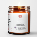 Back label of amber glass candle jar showing product details. 100% soy wax, handmade in Brooklyn, 45-50 hour burn time, non-toxic, 9oz size. Features Virgins on Fire Candle Co. branding, contact information, and cartoon mascot with rainbow flag. Includes note about being handmade by a gay man rather than a corporation."