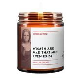 a candle jar with a label of an angry woman. the candle name is Women Are Mad That Men Even Exist. It is a vanilla and orchid scented candle