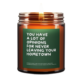 Candle jar with a green label featuring text on a white background.