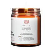 Back label of amber glass candle jar showing product details. 100% soy wax, handmade in Brooklyn, 45-50 hour burn time, non-toxic, 9oz size. Features Virgins on Fire Candle Co. branding, contact information, and cartoon mascot with rainbow flag. Includes note about being handmade by a gay man rather than a corporation."