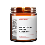 Gin and cypress scented candle 'We're Going to the Catskills!' from gay-owned Brooklyn brand featuring retro-style black and white photo of person in car