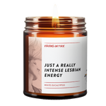Bestselling 'Just A Really Intense Lesbian Energy' candle with White Eucalyptus fragrance from LGBTQ+-owned Virgins On Fire Candle Co. 9oz soy wax candle in amber glass jar with artistic label design. Handmade in Brooklyn with queer humor and pride. Perfect gift for the LGBTQ+ community and allies
