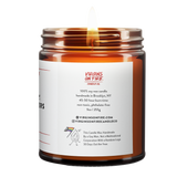 Back label of amber glass candle jar showing product details for Virgins On Fire Candle Co, a funny candle, gay-owned small business in Brooklyn, NY. 100% soy wax, handmade in Brooklyn, 45-50 hour burn time, non-toxic, 9oz size. Features Virgins on Fire Candle Co. branding, contact information, and cartoon flame mascot with rainbow flag. Includes a note about being handmade by a gay man rather than a corporation with a rainbow logo 30 days out of the year."